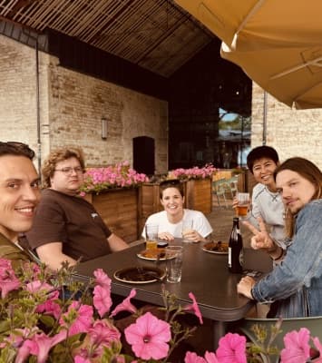 XYB colleagues around a table outdoors